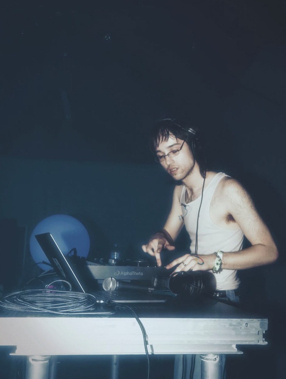 Myles behind the decks during a live set